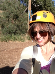Karen Pery smiling for the camera while climbing