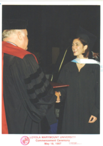 Karen Pery receiving her diploma at Loyola Marymount University