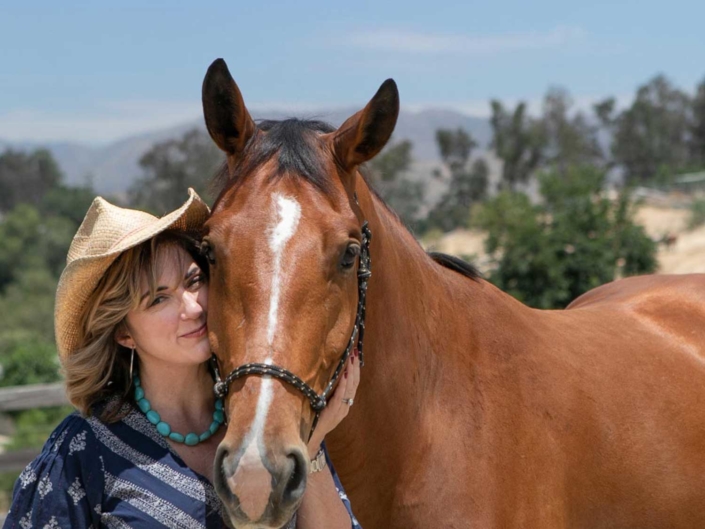 journey-of-horses-FEAT Karen Pery standing beside a gentle horse
